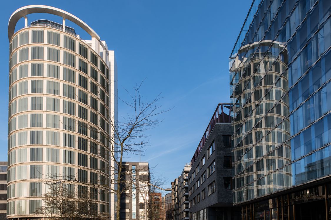 Explore the sleek modern architecture of Hafencity, Hamburg with stunning glass facades and urban design.